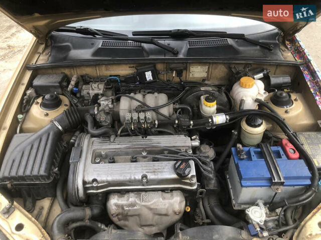 Желтый Дэу Ланос, объемом двигателя 1.6 л и пробегом 215 тыс. км за 2500 $, фото 11 на Automoto.ua