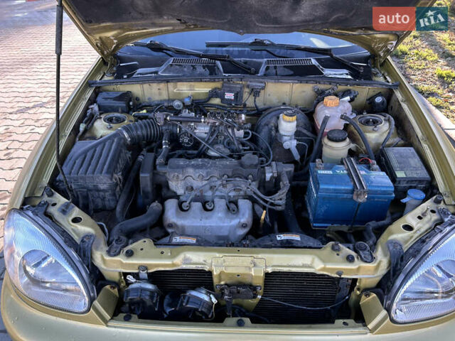 Жовтий Деу Ланос, об'ємом двигуна 1.5 л та пробігом 268 тис. км за 1800 $, фото 13 на Automoto.ua
