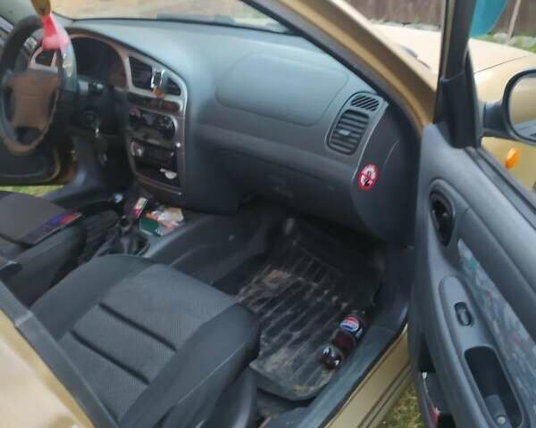 Желтый Дэу Ланос, объемом двигателя 1.6 л и пробегом 265 тыс. км за 2850 $, фото 10 на Automoto.ua