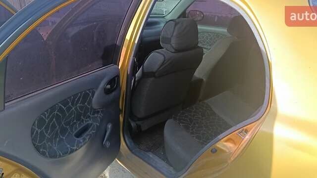 Желтый Дэу Ланос, объемом двигателя 1.5 л и пробегом 272 тыс. км за 2000 $, фото 6 на Automoto.ua