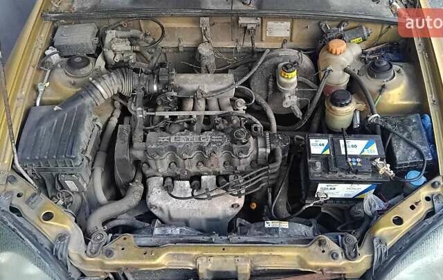 Желтый Дэу Ланос, объемом двигателя 1.5 л и пробегом 272 тыс. км за 2000 $, фото 2 на Automoto.ua