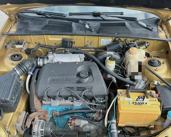 Желтый Дэу Ланос, объемом двигателя 1.3 л и пробегом 200 тыс. км за 1400 $, фото 8 на Automoto.ua