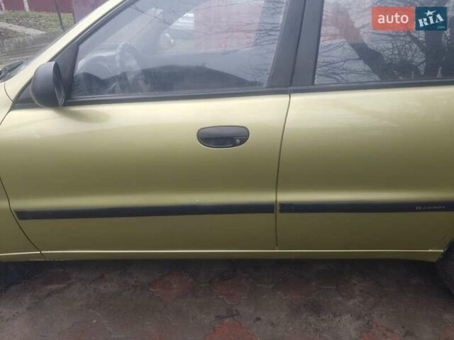 Желтый Дэу Ланос, объемом двигателя 1.5 л и пробегом 190 тыс. км за 1750 $, фото 5 на Automoto.ua