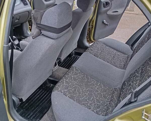 Желтый Дэу Ланос, объемом двигателя 1.39 л и пробегом 195 тыс. км за 2200 $, фото 16 на Automoto.ua