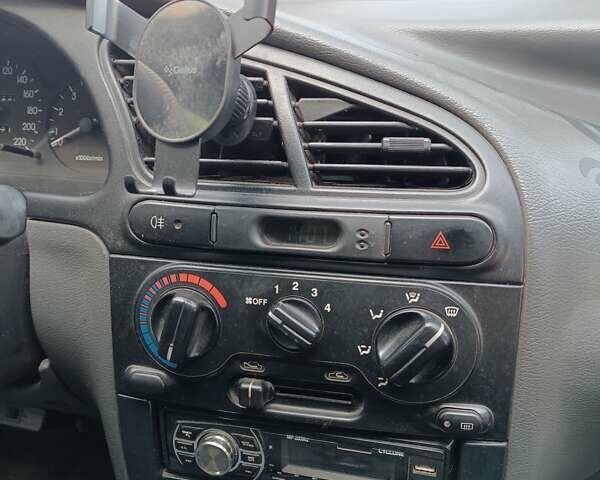Желтый Дэу Ланос, объемом двигателя 1.5 л и пробегом 244 тыс. км за 1490 $, фото 2 на Automoto.ua