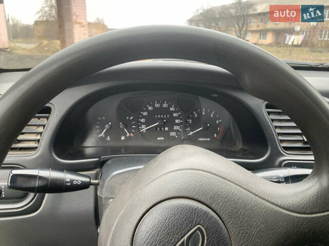 Жовтий Деу Ланос, об'ємом двигуна 1.5 л та пробігом 126 тис. км за 1899 $, фото 6 на Automoto.ua