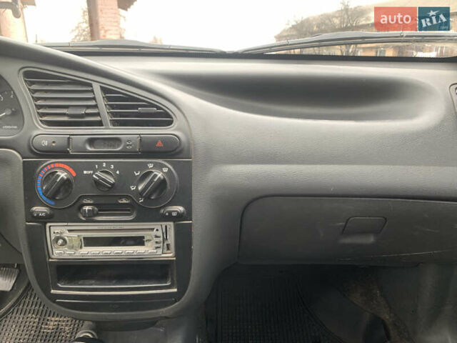 Жовтий Деу Ланос, об'ємом двигуна 1.5 л та пробігом 126 тис. км за 1899 $, фото 7 на Automoto.ua