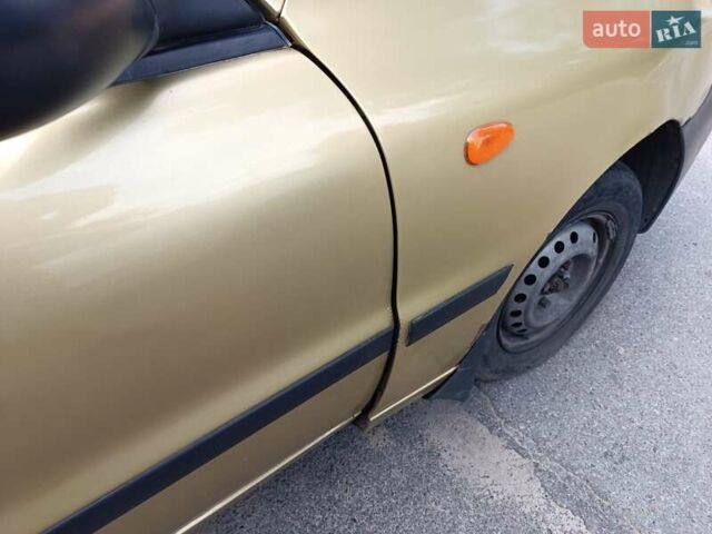 Желтый Дэу Ланос, объемом двигателя 1.5 л и пробегом 244 тыс. км за 1490 $, фото 11 на Automoto.ua