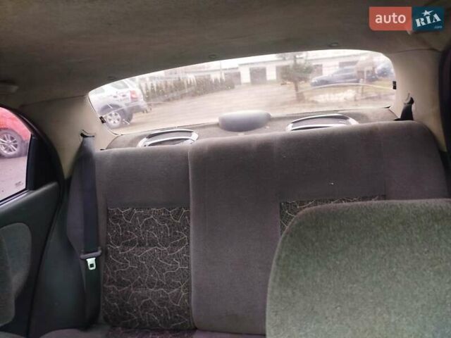 Желтый Дэу Ланос, объемом двигателя 1.5 л и пробегом 200 тыс. км за 1300 $, фото 7 на Automoto.ua