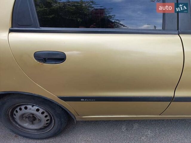 Желтый Дэу Ланос, объемом двигателя 1.5 л и пробегом 244 тыс. км за 1490 $, фото 12 на Automoto.ua