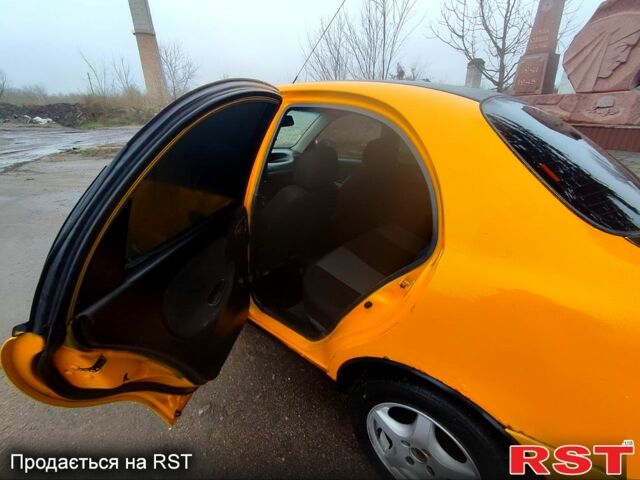 Желтый Дэу Ланос, объемом двигателя 1.4 л и пробегом 269 тыс. км за 1250 $, фото 8 на Automoto.ua