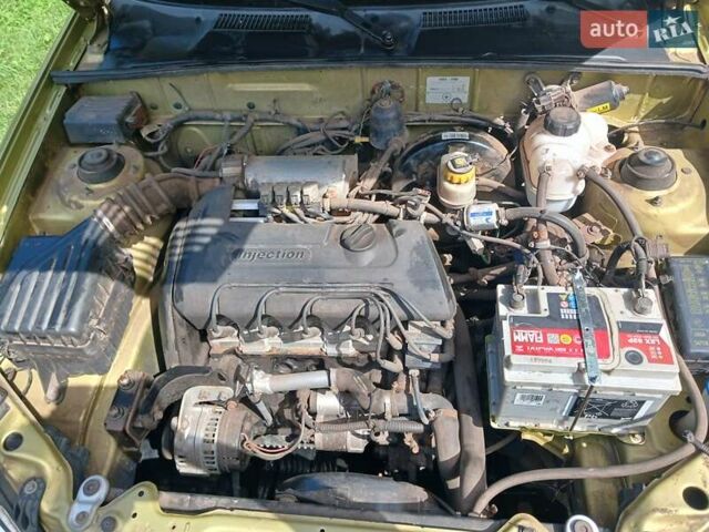 Желтый Дэу Ланос, объемом двигателя 1.39 л и пробегом 105 тыс. км за 2650 $, фото 5 на Automoto.ua