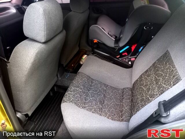 Желтый Дэу Ланос, объемом двигателя 1.4 л и пробегом 117 тыс. км за 2550 $, фото 4 на Automoto.ua