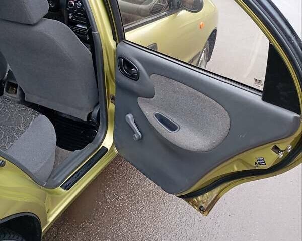 Желтый Дэу Ланос, объемом двигателя 1.39 л и пробегом 195 тыс. км за 2200 $, фото 14 на Automoto.ua