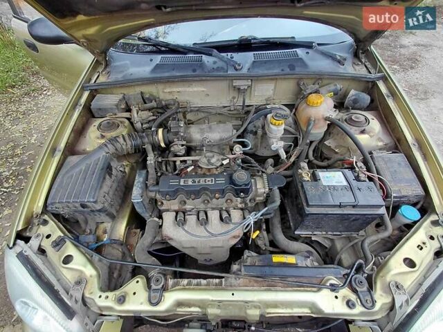 Желтый Дэу Ланос, объемом двигателя 1.5 л и пробегом 250 тыс. км за 1700 $, фото 6 на Automoto.ua