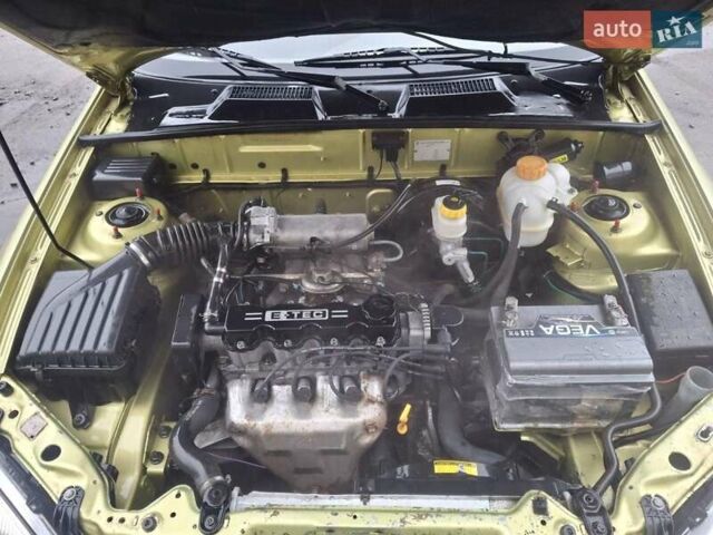 Желтый Дэу Ланос, объемом двигателя 1.49 л и пробегом 200 тыс. км за 1650 $, фото 9 на Automoto.ua