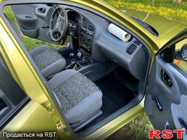 Желтый Дэу Ланос, объемом двигателя 1.5 л и пробегом 43 тыс. км за 4500 $, фото 7 на Automoto.ua