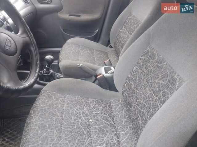 Желтый Дэу Ланос, объемом двигателя 1.5 л и пробегом 190 тыс. км за 1750 $, фото 18 на Automoto.ua