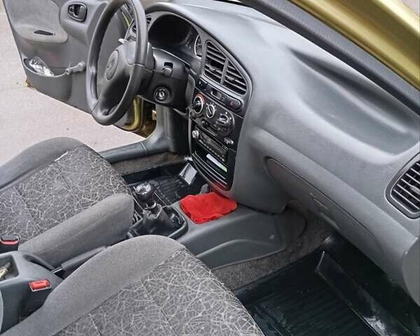 Желтый Дэу Ланос, объемом двигателя 1.39 л и пробегом 195 тыс. км за 2200 $, фото 15 на Automoto.ua