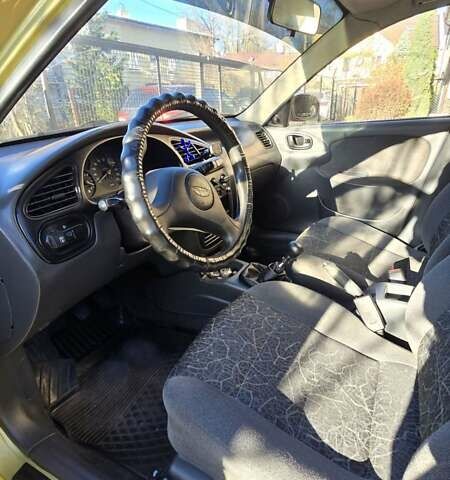 Желтый Дэу Ланос, объемом двигателя 1.5 л и пробегом 310 тыс. км за 1500 $, фото 9 на Automoto.ua