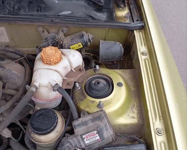 Желтый Дэу Ланос, объемом двигателя 1.39 л и пробегом 195 тыс. км за 2200 $, фото 18 на Automoto.ua