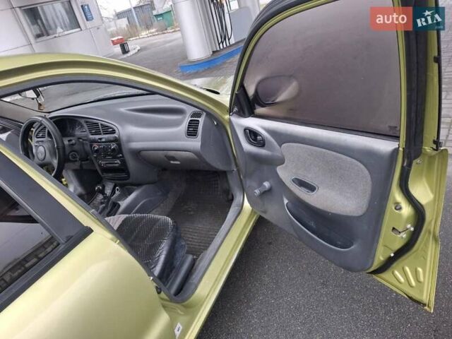 Желтый Дэу Ланос, объемом двигателя 1.49 л и пробегом 200 тыс. км за 1650 $, фото 5 на Automoto.ua