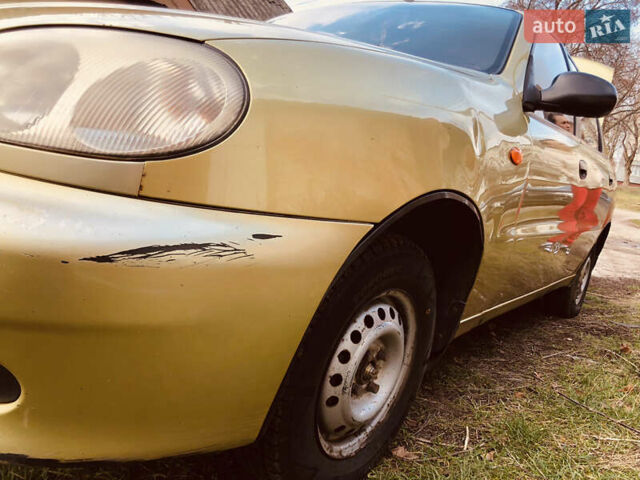 Жовтий Деу Ланос, об'ємом двигуна 1.39 л та пробігом 240 тис. км за 1700 $, фото 25 на Automoto.ua