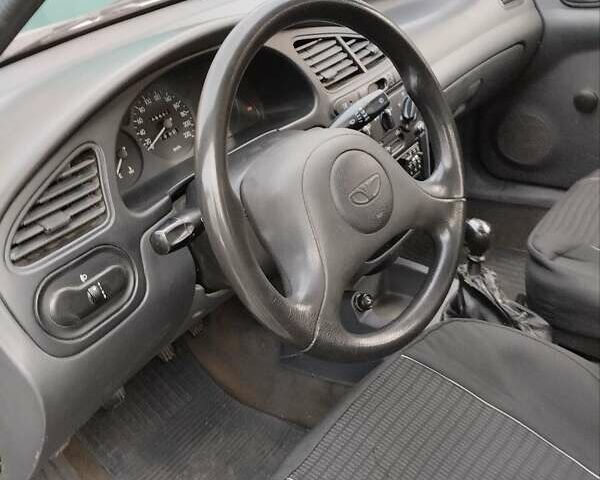 Сірий Деу Ланос, об'ємом двигуна 1.35 л та пробігом 117 тис. км за 1400 $, фото 2 на Automoto.ua