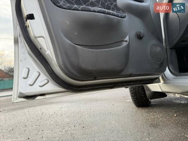 Сірий Деу Ланос, об'ємом двигуна 1.35 л та пробігом 116 тис. км за 1950 $, фото 13 на Automoto.ua