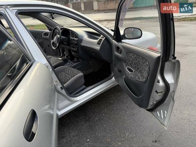 Сірий Деу Ланос, об'ємом двигуна 1.35 л та пробігом 116 тис. км за 1950 $, фото 12 на Automoto.ua