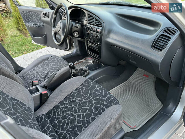 Серый Дэу Ланос, объемом двигателя 1.5 л и пробегом 152 тыс. км за 1999 $, фото 26 на Automoto.ua