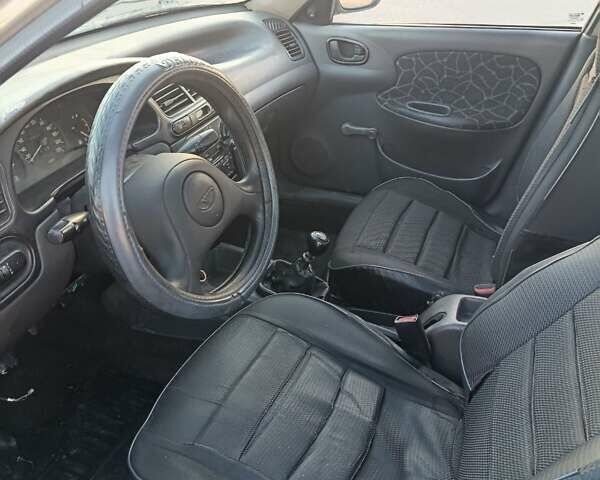 Серый Дэу Ланос, объемом двигателя 1.6 л и пробегом 270 тыс. км за 1000 $, фото 6 на Automoto.ua