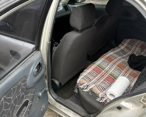 Сірий Деу Ланос, об'ємом двигуна 0 л та пробігом 254 тис. км за 1450 $, фото 11 на Automoto.ua