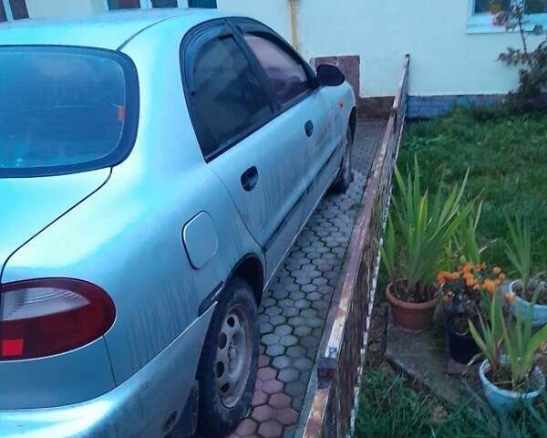 Серый Дэу Ланос, объемом двигателя 1.5 л и пробегом 235 тыс. км за 1950 $, фото 2 на Automoto.ua