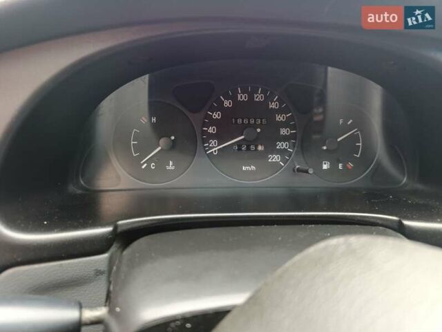 Серый Дэу Ланос, объемом двигателя 1.5 л и пробегом 190 тыс. км за 2000 $, фото 4 на Automoto.ua