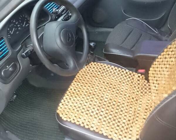 Серый Дэу Ланос, объемом двигателя 1.5 л и пробегом 207 тыс. км за 2000 $, фото 4 на Automoto.ua