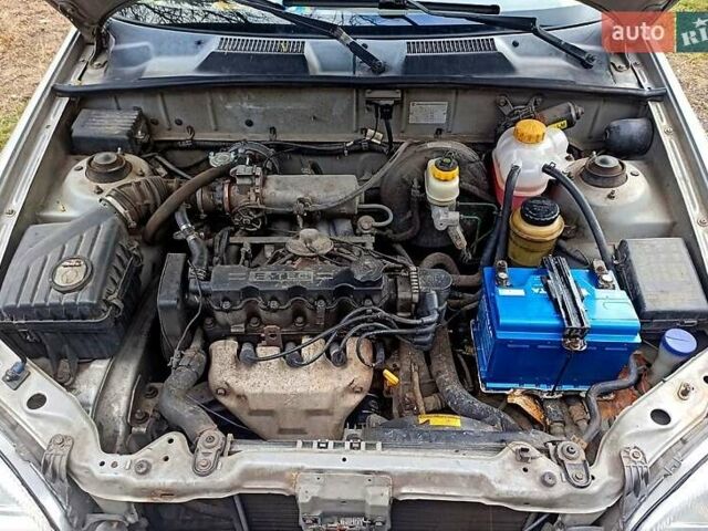 Серый Дэу Ланос, объемом двигателя 1.5 л и пробегом 306 тыс. км за 1950 $, фото 8 на Automoto.ua