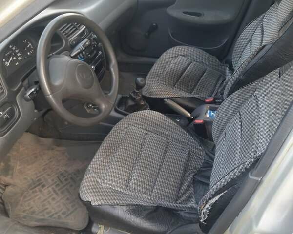 Серый Дэу Ланос, объемом двигателя 1.5 л и пробегом 63 тыс. км за 4099 $, фото 4 на Automoto.ua