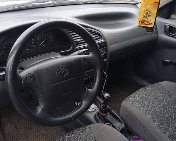 Серый Дэу Ланос, объемом двигателя 1.5 л и пробегом 212 тыс. км за 1950 $, фото 8 на Automoto.ua