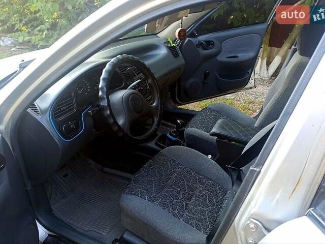 Серый Дэу Ланос, объемом двигателя 1.5 л и пробегом 306 тыс. км за 1950 $, фото 2 на Automoto.ua