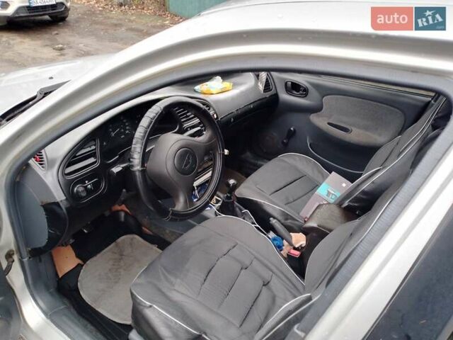 Серый Дэу Ланос, объемом двигателя 1.5 л и пробегом 210 тыс. км за 1800 $, фото 3 на Automoto.ua