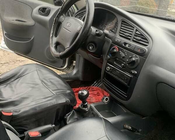 Серый Дэу Ланос, объемом двигателя 1.6 л и пробегом 260 тыс. км за 1650 $, фото 2 на Automoto.ua