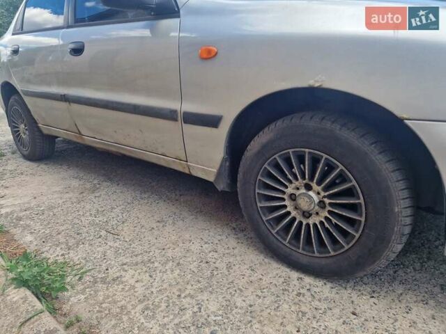 Сірий Деу Ланос, об'ємом двигуна 1.5 л та пробігом 313 тис. км за 1000 $, фото 7 на Automoto.ua