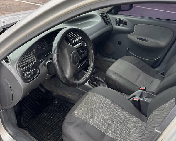 Сірий Деу Ланос, об'ємом двигуна 1.39 л та пробігом 314 тис. км за 1500 $, фото 11 на Automoto.ua