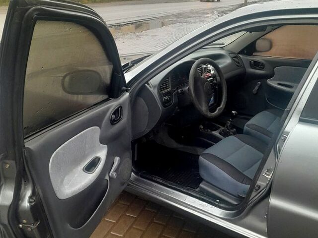 Серый Дэу Ланос, объемом двигателя 1.5 л и пробегом 237 тыс. км за 1950 $, фото 5 на Automoto.ua