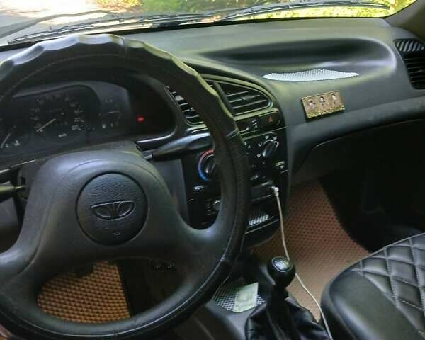 Сірий Деу Ланос, об'ємом двигуна 1.39 л та пробігом 198 тис. км за 2200 $, фото 2 на Automoto.ua