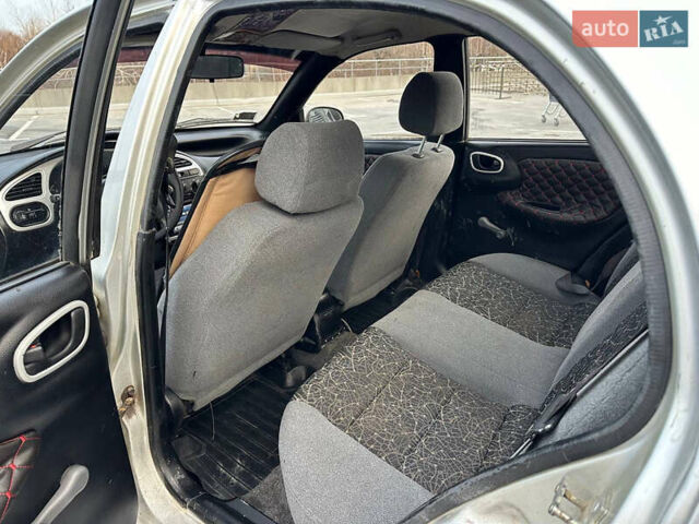 Сірий Деу Ланос, об'ємом двигуна 1.6 л та пробігом 305 тис. км за 1999 $, фото 5 на Automoto.ua