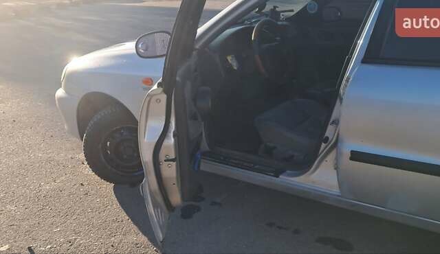 Сірий Деу Ланос, об'ємом двигуна 1.39 л та пробігом 220 тис. км за 3000 $, фото 7 на Automoto.ua