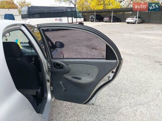 Серый Дэу Ланос, объемом двигателя 1.5 л и пробегом 179 тыс. км за 2000 $, фото 18 на Automoto.ua