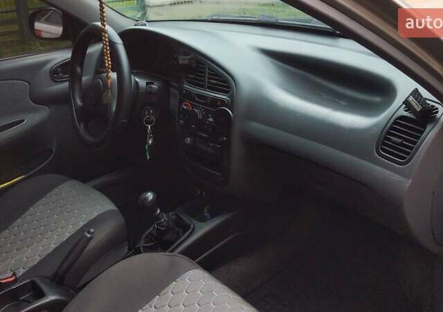 Серый Дэу Ланос, объемом двигателя 1.5 л и пробегом 210 тыс. км за 2000 $, фото 15 на Automoto.ua